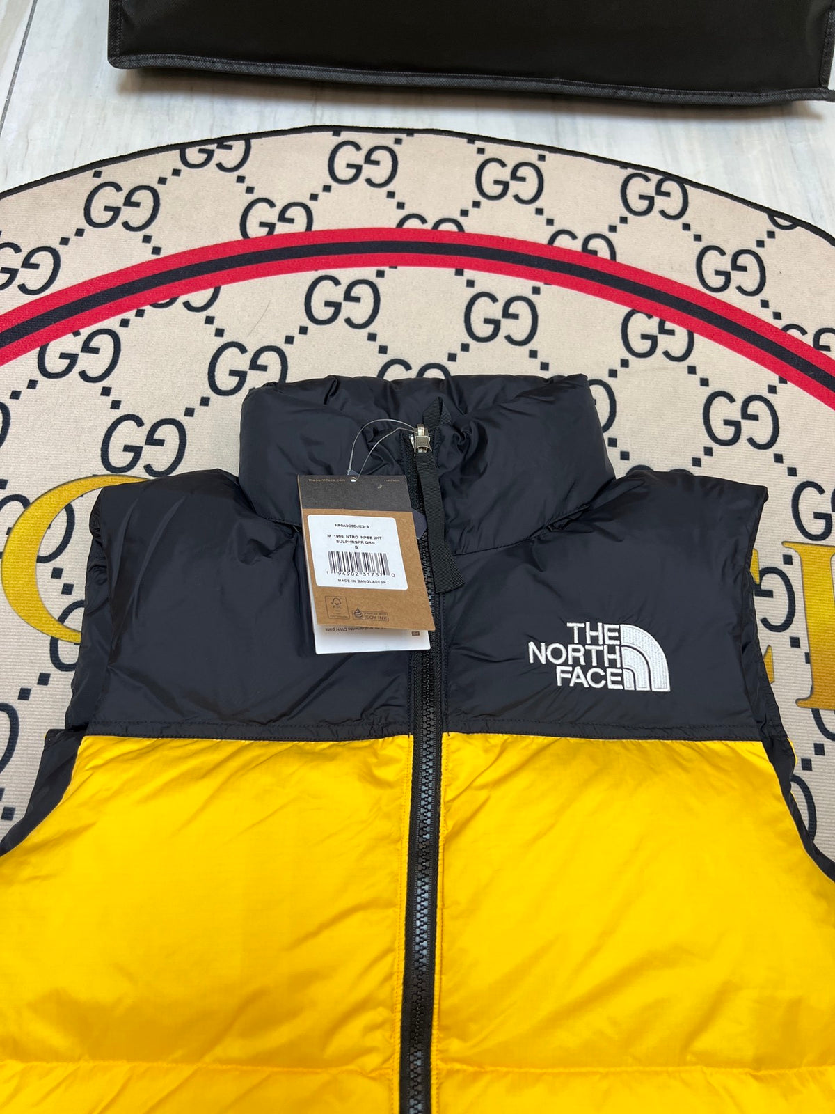 The North Face Yellow & Black Colorblock Puffer Vest